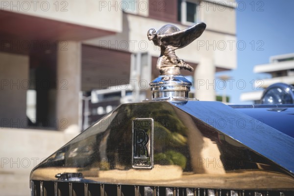 Lisbon, Portugal - Sep 29, 2024: Close-up and selective focus on the Rolls-Royce mascot hood