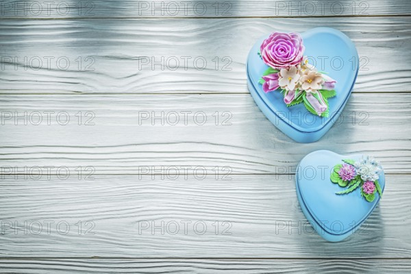 Wrapped gift boxes on wooden board holidays concept