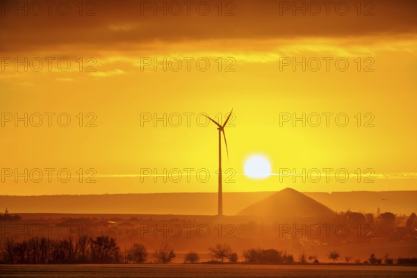 Sunrise with a view of wind turbines and mining heaps from the copper mines in the south of the