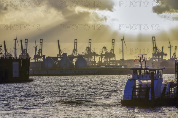 Amazing landscape, An engineering ship (tugboat) and docks in Hamburg, yellow sunset. October in