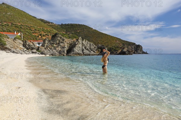 Young woman at the beach Kalamos in Evia island, Greece, Europe