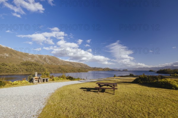 The picturesque landscape from Lake Pedder Wilderness Lodge over Lake Pedder on a hot summer's