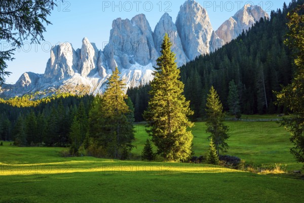 Italy. Majestic Dolomites. Powerful mountain peaks surround the piicturesque green valley Val di
