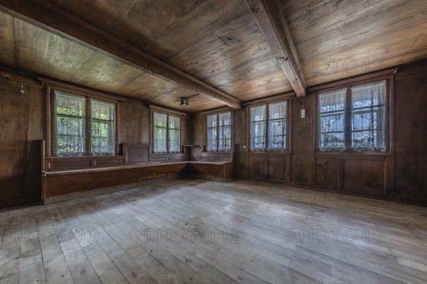The living room with wooden corner bench in a house built around 1750 that has since been