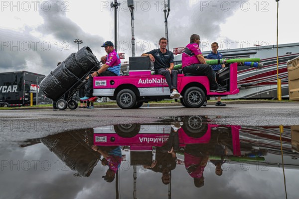 Crew members of Andretti Autosport Honda prepare their race car for the Big Machine Music City