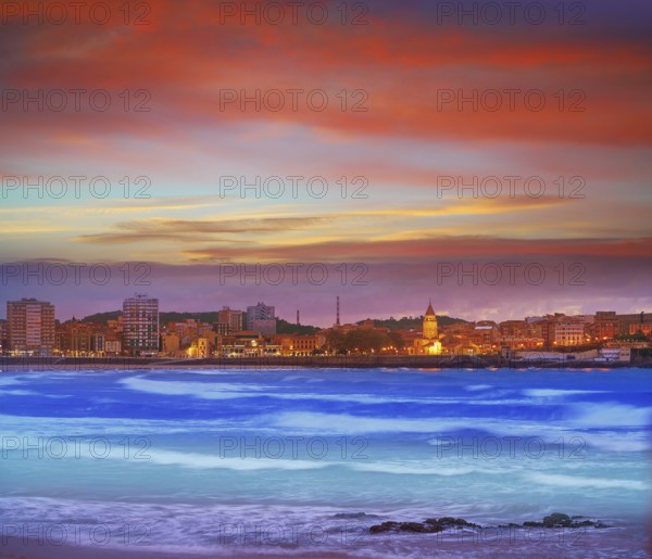 Gijon skyline sunset in San Lorenzo beach of Asturias in Spain