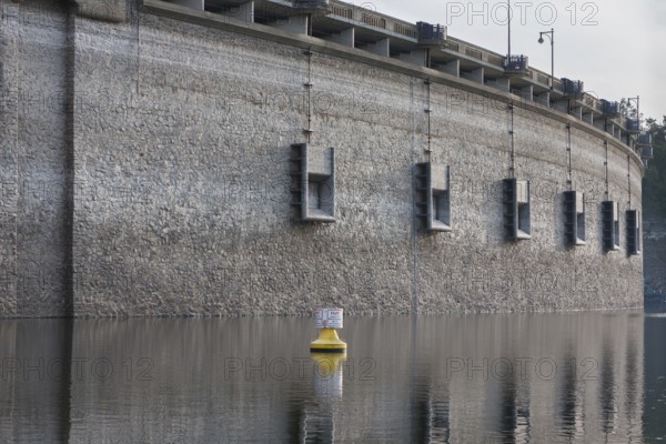 Edersee at low water level and a yellow buoy, Edertalsperre with medium drains