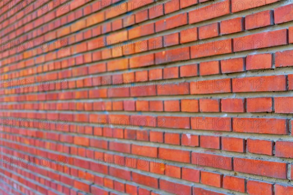 The background of the old red brick wall for design interior and various scenes or as a background