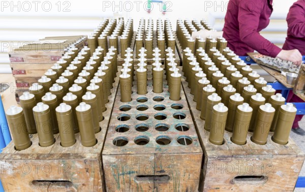 RPG explosive elements of anti tank rocket-propelled grenades (RPGs, bazooka) near an assembly line