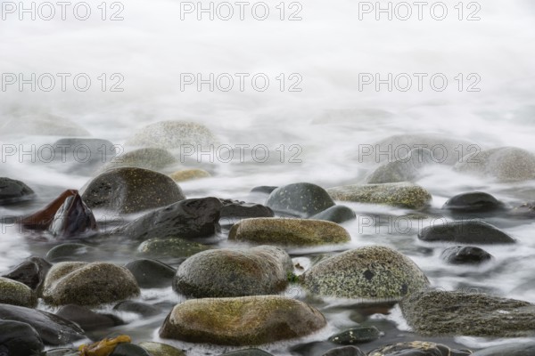 Returning ocean tide on a rocky coast on Quadra Island in Canada