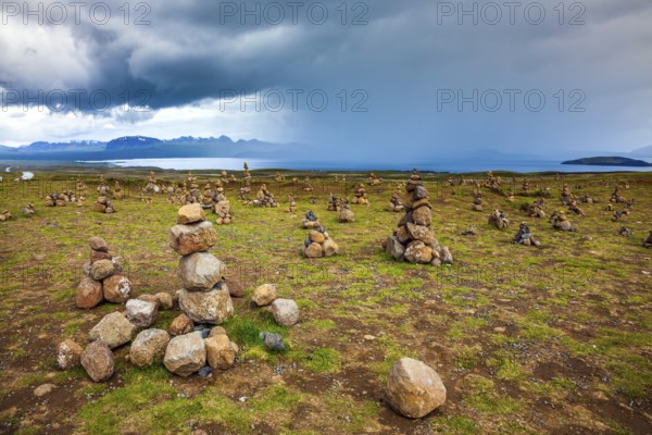 Stone pyramids bring good luck in the journey. The stone pyramids are a symbol of Iceland. Field of