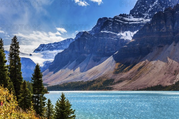The Rockies of Canada. The picturesque huge and deep Lake Bow is surrounded by cliffs and glaciers.