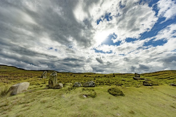 Druids Circle, stone circle in wide landscape with pastures in the mountains, Penmaenmawr,