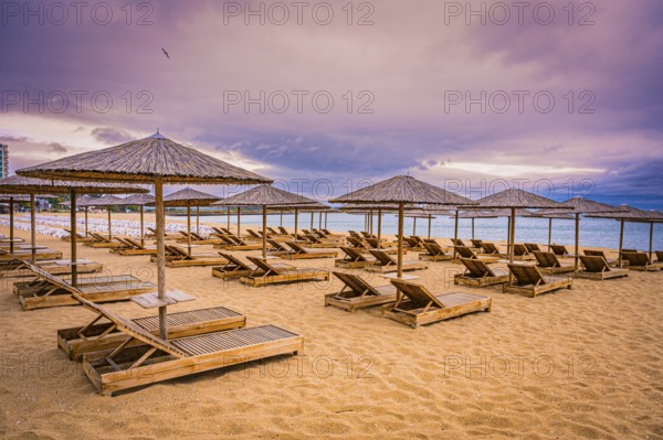 The beach has sunbeds and bamboo parasols and appears quiet and deserted when the sky is cloudy,
