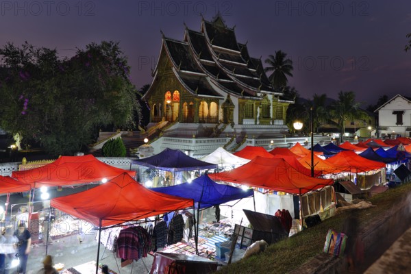 Night market in front of the Buddhist temple Haw Phra Bang of the Royal Palace, National Museum on