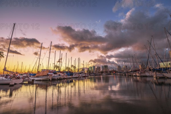 Dramatic landscape of sailing boats and yachts docked at the Ala Wai Harbor, the largest yacht
