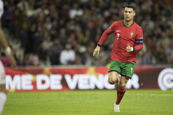Football match, captain Cristiano RONALDO CR7 Portugal running slowly to the left with a