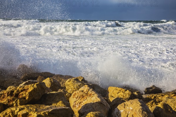 New Quay in the Old Jaffa in a winter storm. Huge foaming waves of the Mediterranean beat against