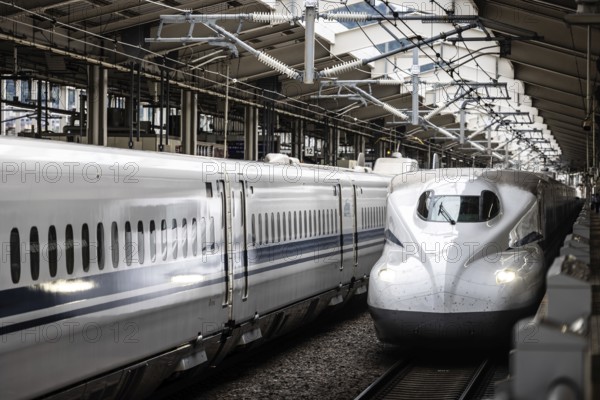 KYOTO, JAPAN - SEPTEMBER 24 2024: A Shinkansen high-speed bullet train arriving at Kyoto Station in