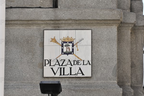 Coat of arms sign on a stone wall with the inscription 'Plaza de la Villa', Madrid, Spain, Europe