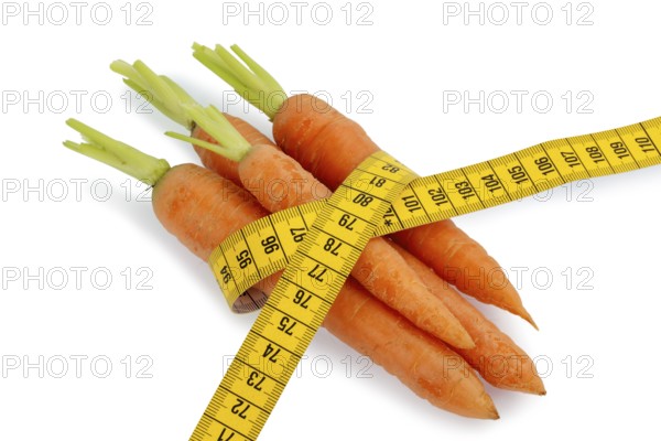 Organically grown carrots with measuring tape Fresh fruit and vegetables are always healthy.