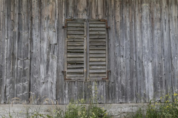 Wooden wall with closed wooden shutters from the former Brunner staff house which has since been