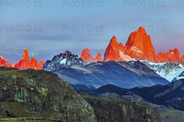 The grand crimson dawn over the mountain range Fitzroy. Mountain peak in Patagonia. Magnificent