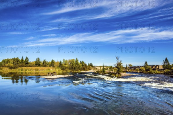 Landscape in the Old Pinawa Dam Park, broad and stormy Winnipeg River. Trend of travel Around the