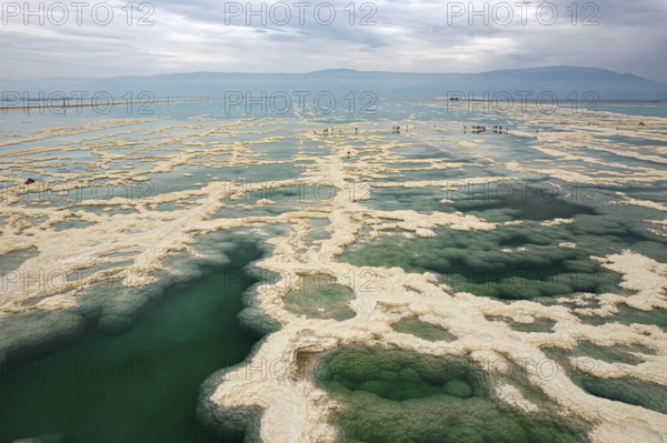 Drone photography. Salt evaporated from the water forms bizarre patterns in the shallow sea water.