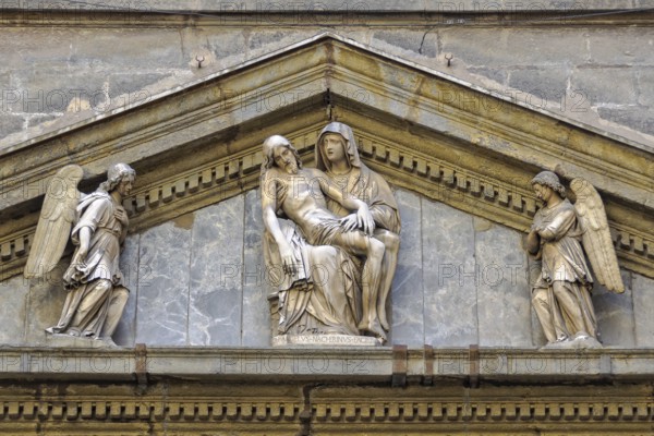Sculpture of La Pieta by Michelangelo Naccherino in the tympanum above the entrance of the Chapel
