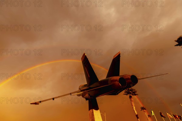 Dawn at Naval Air Field El Centro, CA: Sunlight paints vibrant hues across the sky, casting a
