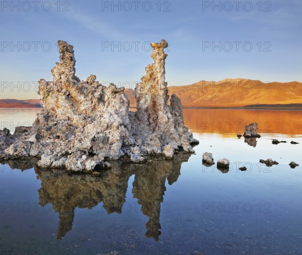 The magic of Mono Lake. Outliers - bizarre limestone formations reflected in the smooth water.