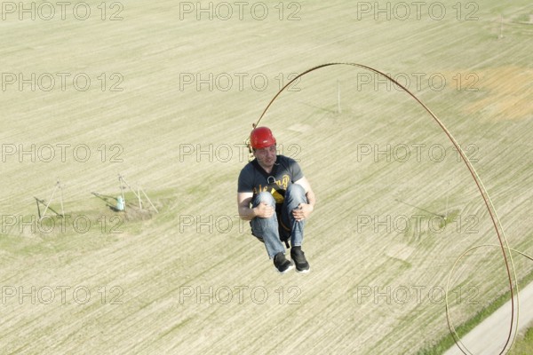 Jumping with a rope.extreme man jumping from a great height.jumping with a rope.flying down on the