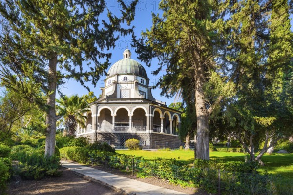Blooming huge park around the monastery. The Lake Tiberias. Church of the Beatitudes. The church is