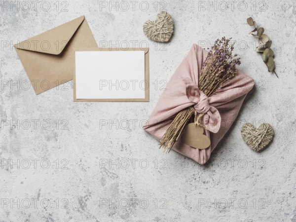 Zero waste Valentine's Day concept and mock up. Eco-friendly gift cloth wrapping in Furoshiki