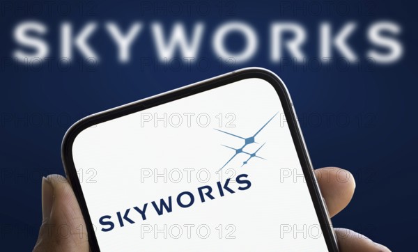 skyworks logo is displayed on smartphone. Skyworks Solutions Inc is an American semiconductor