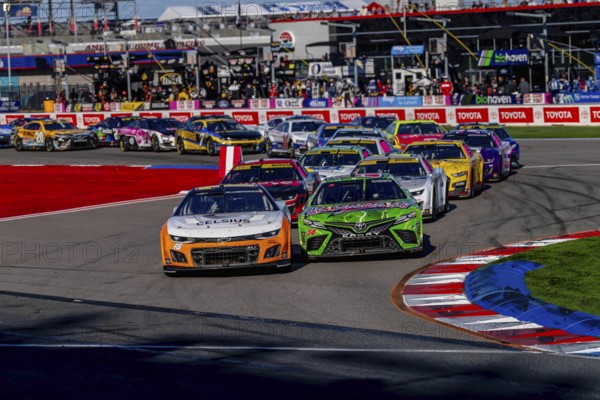 NASCAR Cup Series driver, AJ ALLMENDINGER (16), races through the turns during the Bank of Amercia