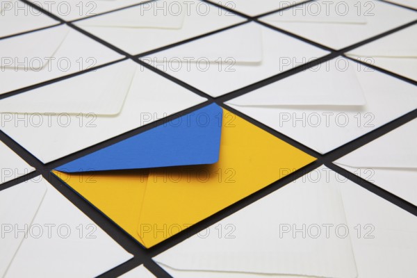 Composition with white and colored envelopes on the table. The photo suitable for various holidays