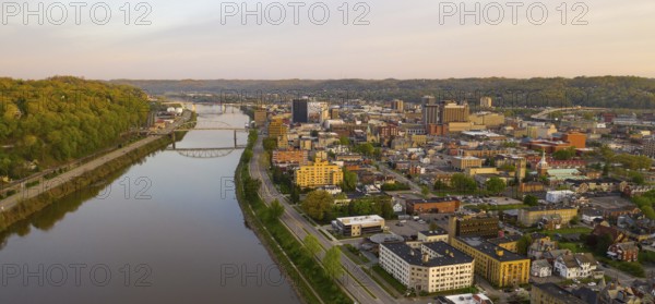 Sunrise reflects in the Kanawha River slowly flowing by picturesque Charleston West Virginia