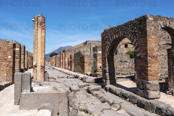 POMPEII, ITALY, MAY 04, 2022, A crosswalk of a typical Roman road in the ancient city of Pompeii,