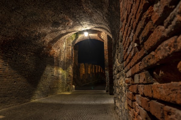 Medieval Passage to the old Castelvecchio Bridge over the Adige River at Night, Verona, Italy,