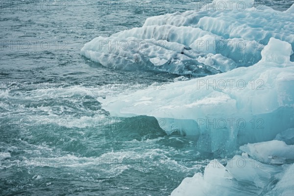 Blue icebergs floating in a cold, tranquil ocean scene, iceberg, glacier, snow, ice rock, ice
