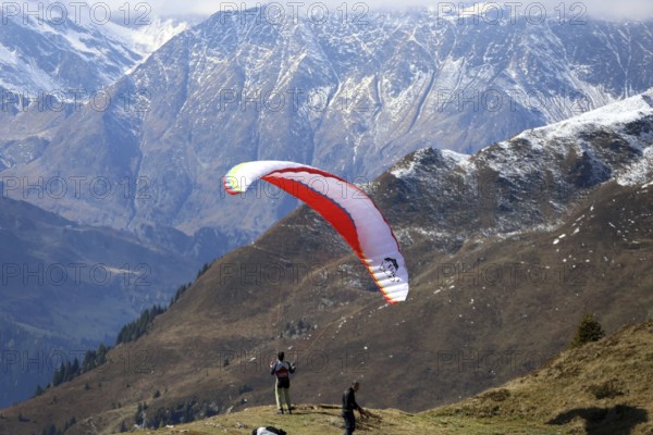 A paraglider takes off in the hiking paradise and holiday region of South Tyrol / Alto Adige on the