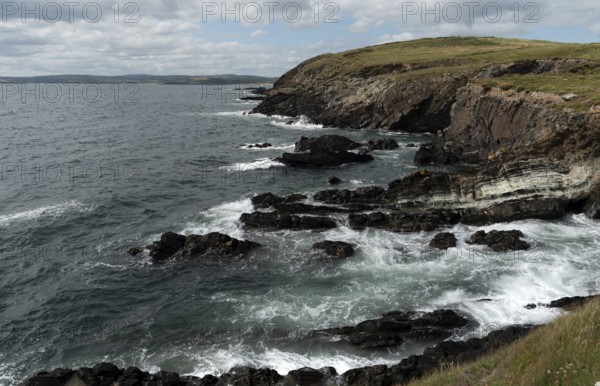 Rocky coastal area with windy waves crashing on the rocks. Atlantic Ocean. Baltimore beacon area
