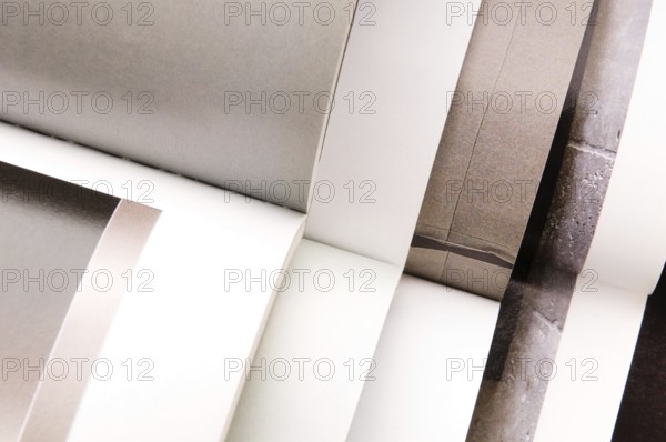 Stack of open magazines