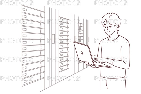 Male engineer with laptop standing near server room with computers. Man IT specialist working in