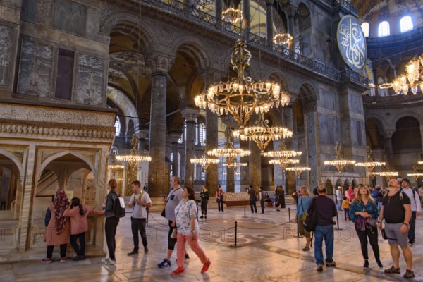 Tourists inside Hagia Sophia, former Orthodox cathedral and Ottoman imperial mosque, in Istanbul,