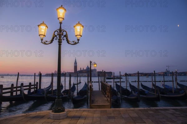 Dawn, Venetian gondolas with the church of San Giorgio Maggiore in the background, Venice, UNESCO