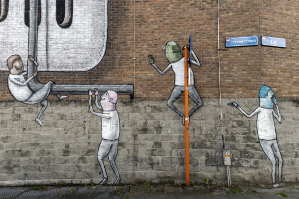 Large wall graffiti on the brick wall of buildings in Craenendonck Street, Leuven, Flanders,