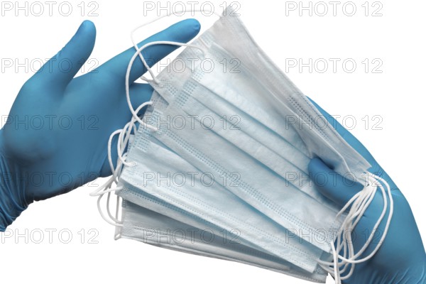 Doctor holding lot medical face mask in two hands blue gloves isolated on white background. Concept